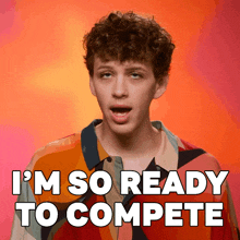 a young man with curly hair is ready to compete