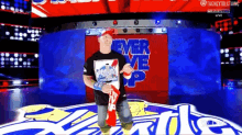 a wrestler stands in front of a sign that says never me up