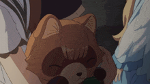 a person holding a stuffed animal that looks like a raccoon with its eyes closed