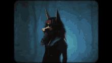 a woman in a fox costume is dancing in the dark .
