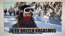 a woman wearing a ski helmet and goggles with the words je to docela orgasmus below her