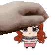a hand is holding a small cartoon girl with red hair and blue eyes .