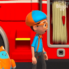 a cartoon boy is standing in front of a fire truck .