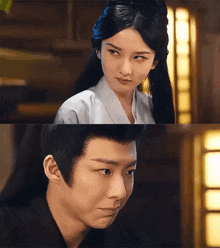 a man and a woman are looking at each other in a room .