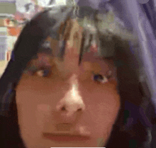 a close up of a woman 's face with a blurry background