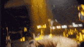 a blurry picture of a crowd at a concert with the number 1 on the bottom right