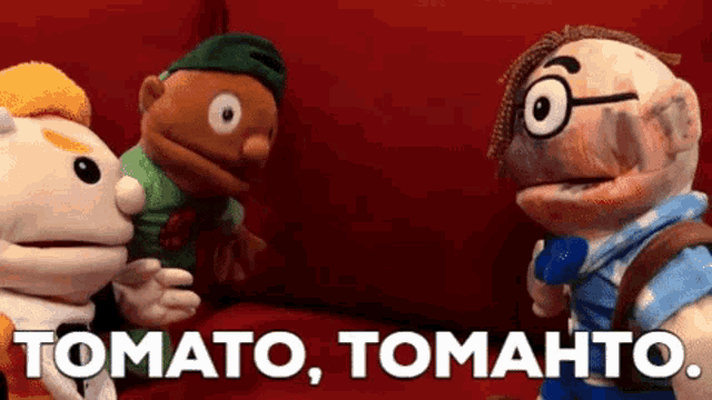 three stuffed animals are sitting on a red couch with the words tomato tomato written in white