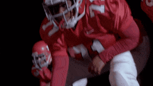 a football player in a red uniform with the number 17 on his jersey