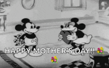 a black and white cartoon of mickey mouse and minnie mouse standing next to each other in a living room .