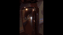 a car is driving through a tunnel with lights on
