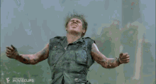 a man with his arms outstretched looks up into the sky