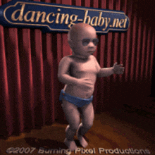 a baby dancing in front of a dancing-baby.net sign