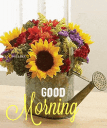 a bouquet of flowers in a watering can with the words good morning written on it