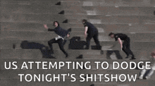 a group of police officers are standing on a set of stairs while a woman runs down them .