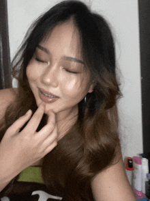 a woman with braces on her teeth is taking a selfie