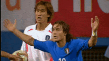 two soccer players one of whom has the number 10 on his shirt