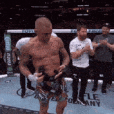 a man in a boxing ring with a sign that says ufc on it
