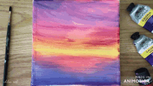 a painting of a sunset with a brush and a bottle of winsor newton gallery acrylic paint