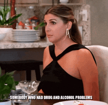 a woman sitting at a table with the words somebody who had drug and alcohol problems written below her