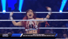 a woman in a wrestling ring with the word royal rumble on the bottom