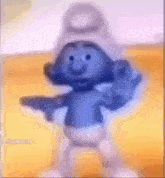 a smurf is holding a gun in his hand and giving a peace sign .