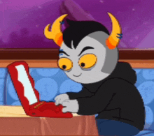 a cartoon character is sitting at a table using a red laptop