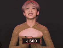 a woman wearing a sweater with a heart cut out on the front