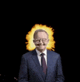 a man in a suit and tie is standing in front of a fire explosion that says this post was locked by the party