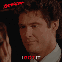 a man in a suit and tie says " i got it "