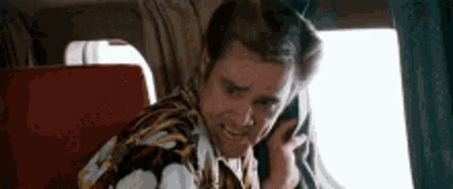 Jim Carrey Ace Ventura GIF - Jim Carrey Ace Ventura Theres Someone On The Wing GIFs