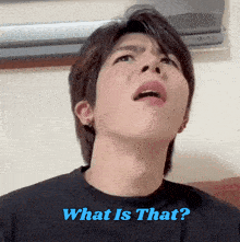 a young man making a funny face with the words what is that written below him