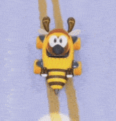 a cartoon bee is driving down a road in a yellow vehicle .