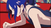 a girl with blue hair has a n on her hair clip