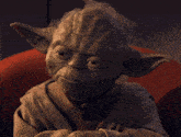 yoda says that brings total obliteration in front of a red chair