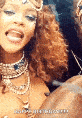 a woman is sticking her tongue out and making a funny face while wearing a necklace .
