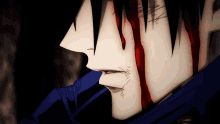 a close up of a man 's face with blood coming out of it