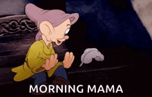 a cartoon of dopey from snow white and the seven dwarfs is sitting on a bench with a feather .