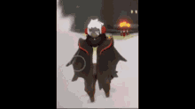 a cartoon character with wings is standing in the snow with a fire in the background .