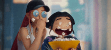 two cartoon characters are eating popcorn and one of them has a bowl of popcorn in her hand