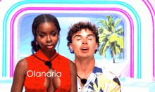 a man and a woman standing next to each other with the word olandria on the bottom