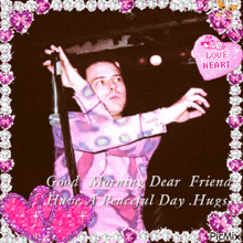a picture of a man holding a microphone with the words good morning dear friend have a peaceful day hugs on the bottom