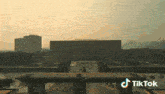 an aerial view of a building with the word tiktok on the bottom right
