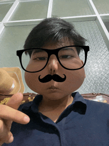 a man wearing glasses and a fake mustache makes a peace sign