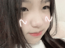 a close up of a girl 's face with a smiley face drawn on it