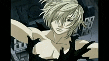 a woman with blonde hair and a black shirt is taking a selfie with her arms outstretched .