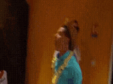 a blurry picture of people dancing in front of a yellow door