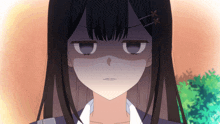 a close up of a girl 's face with an angry expression