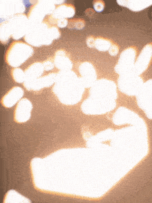 a shadow of a person is cast on a wall by the sun