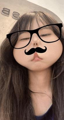 a girl with glasses and a mustache on her face
