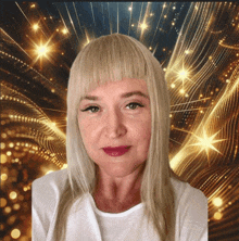 a woman with blonde hair and a white shirt stands in front of a golden background